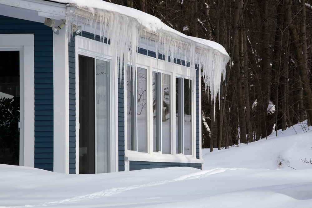 Icicles hanging off a home's rain gutter.